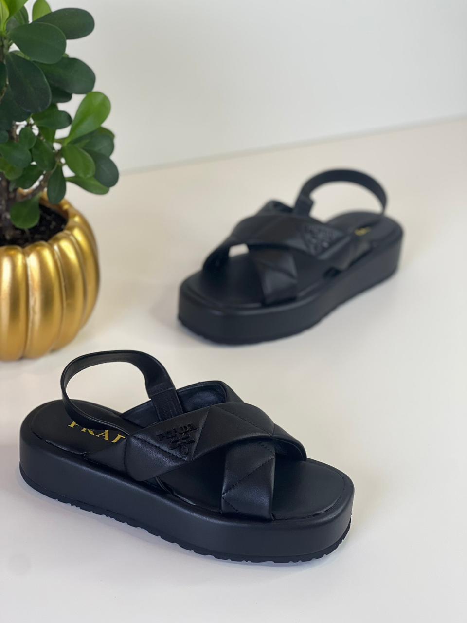 Prada sandals.